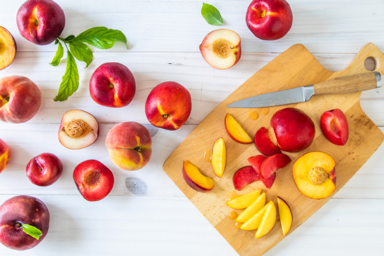 plums on a cutting board